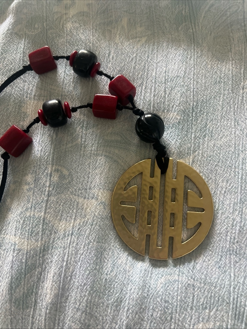 Chico's Red and Black Beaded Necklace with Gold Medallion